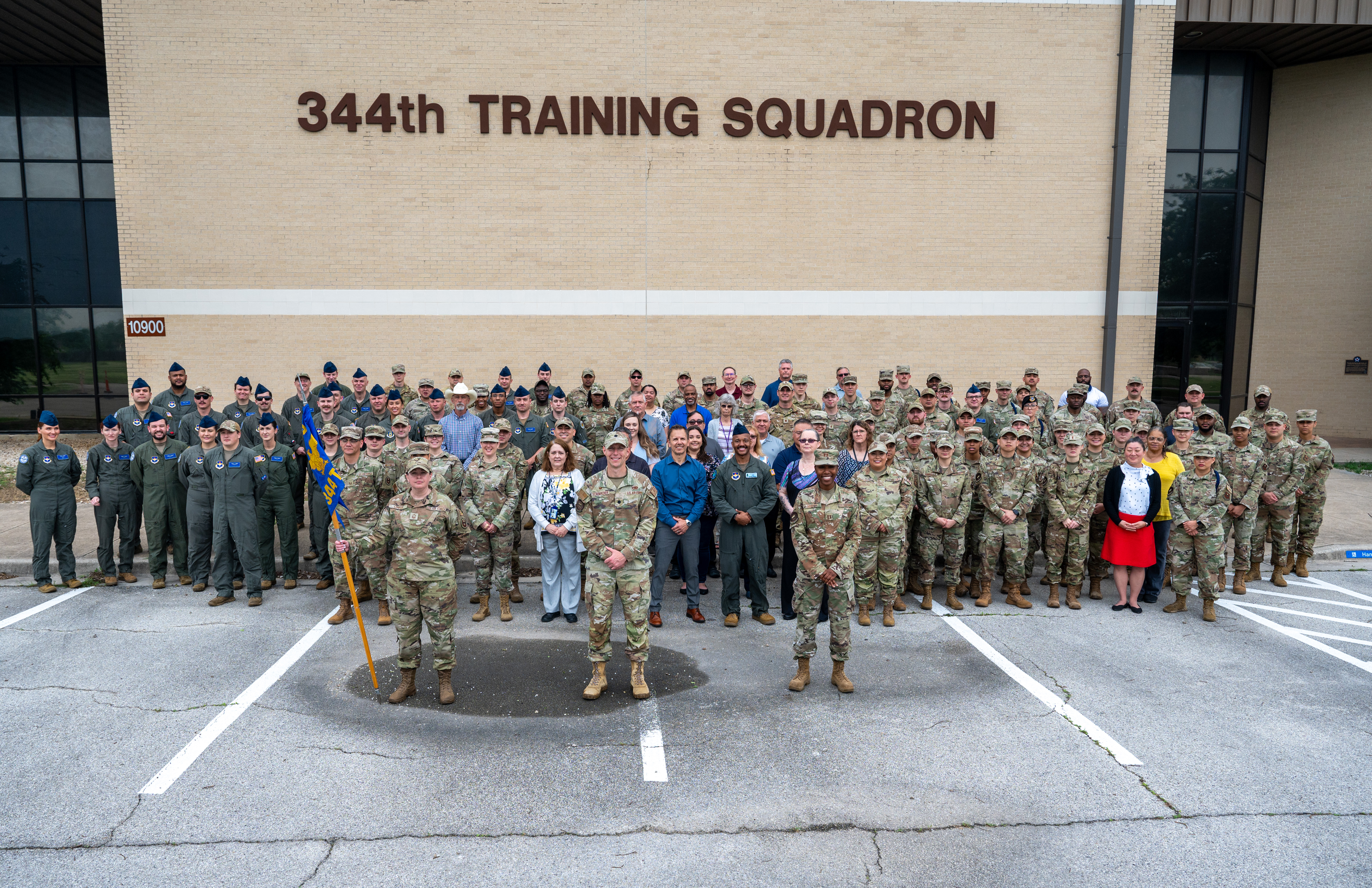 Members of the 344th Training Squadron gather in front of the 344 TRS building for a group photo. Members of the 344th Training Squadron gather in front of the 344 TRS building for a group photo.